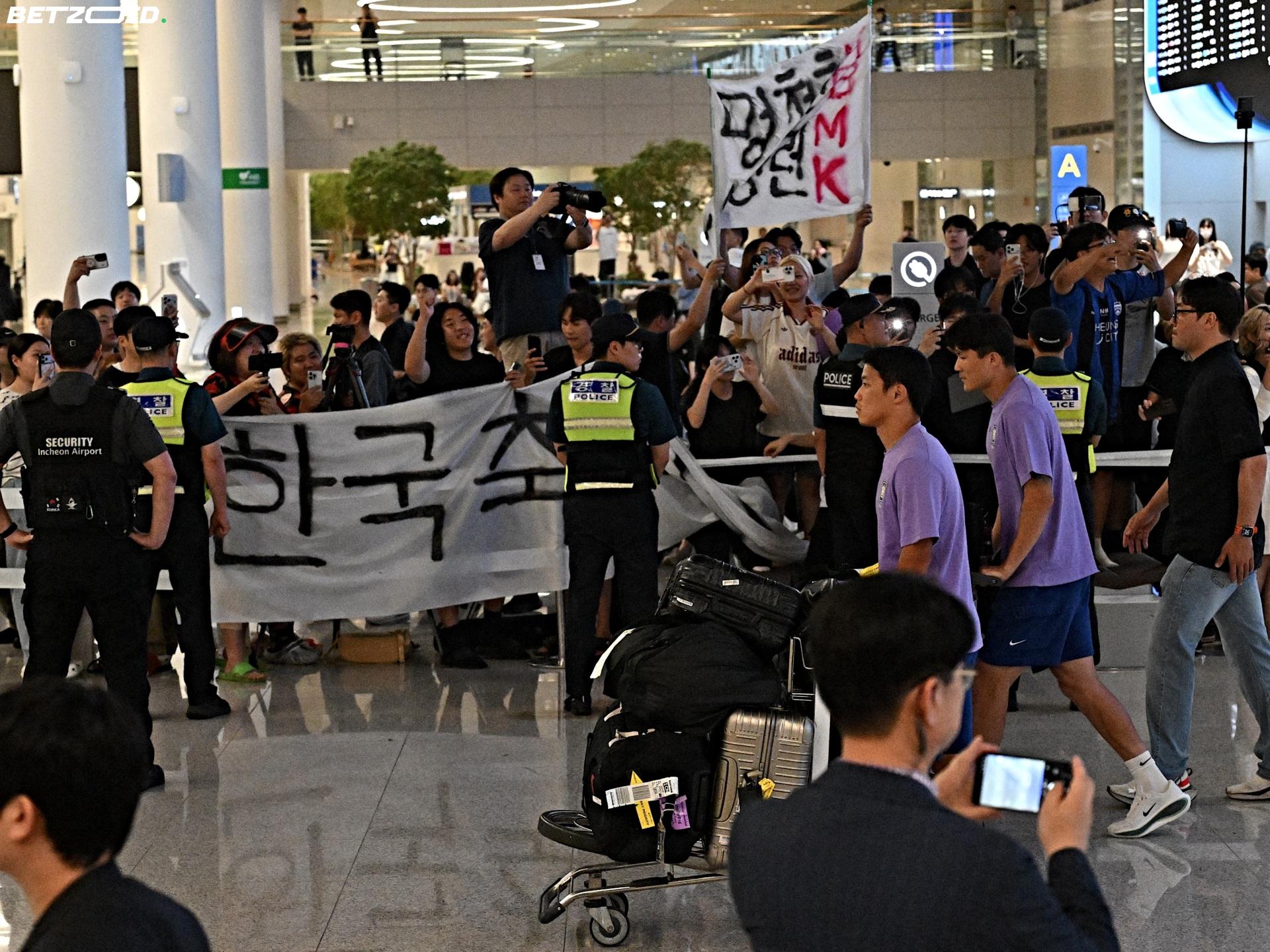 South Korea's World Cup Homecoming: Riot Police, Dog Chews, and a Coach Who Couldn't Hide.