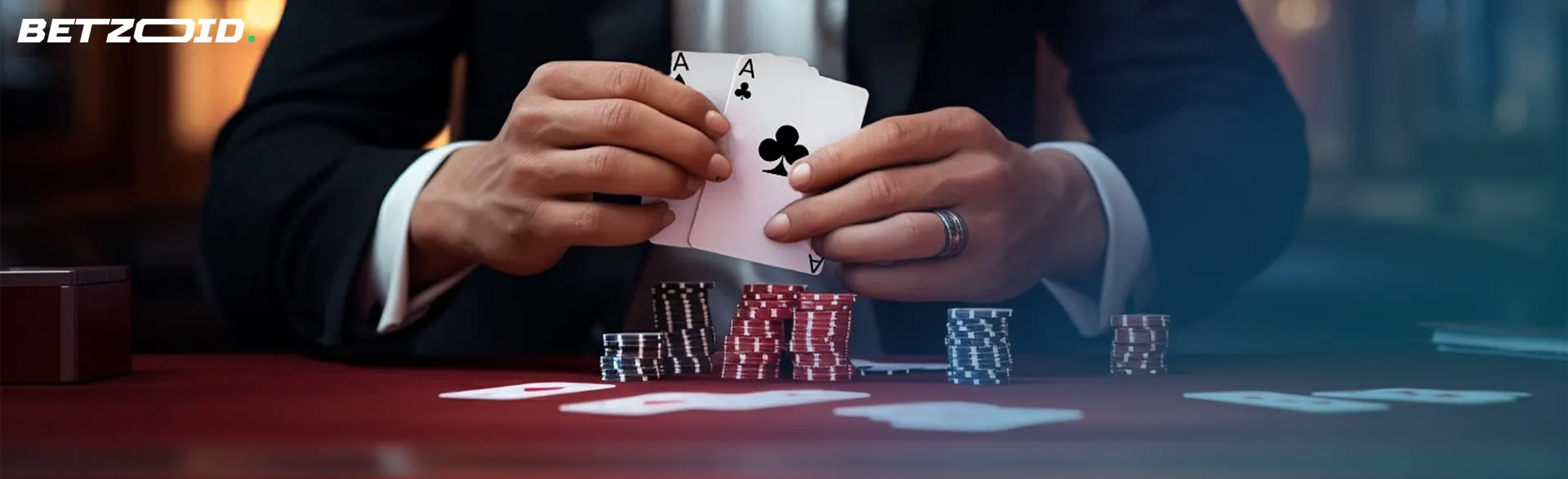 A poker player's hands holding aces, indicative of the high stakes in the best Android casino apps.