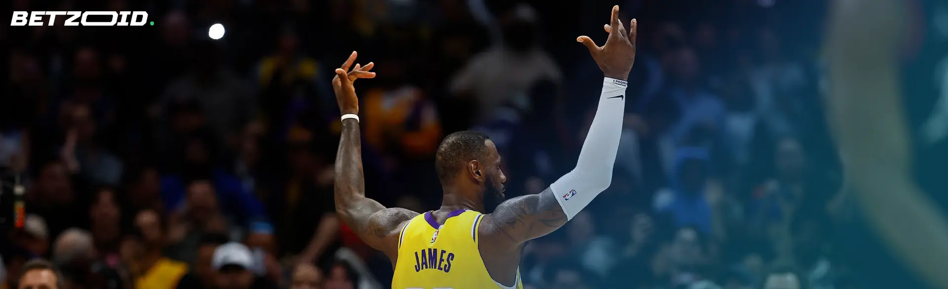 A basketball athlete reaching upwards, symbolic of the aspiration in NBA sportsbooks.