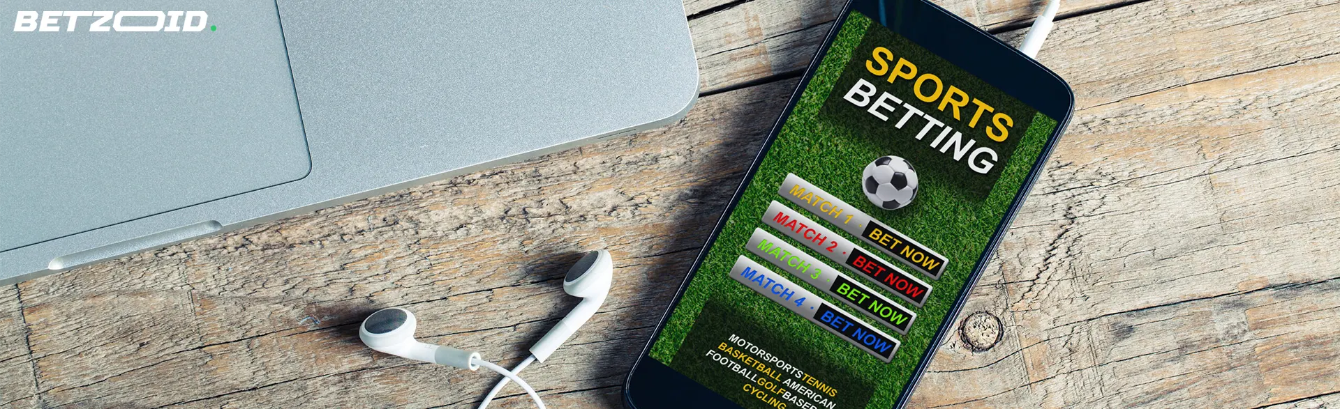 Smartphone displaying sports betting options next to a laptop and earphones, representing C$10 deposit betting sites in Canada.