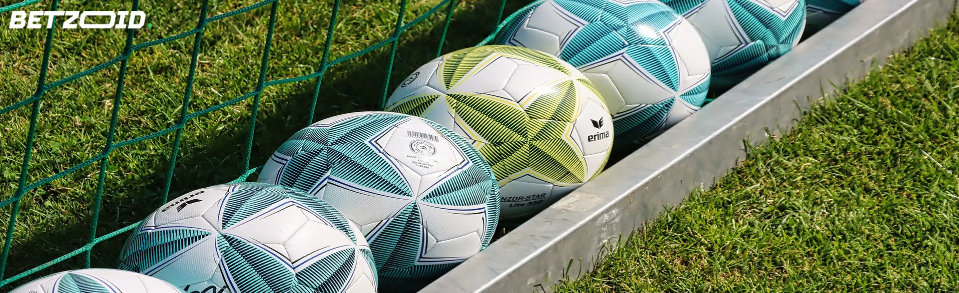 Soccer balls lined up in a goal, ready for action on anonymous betting sites in Australia.