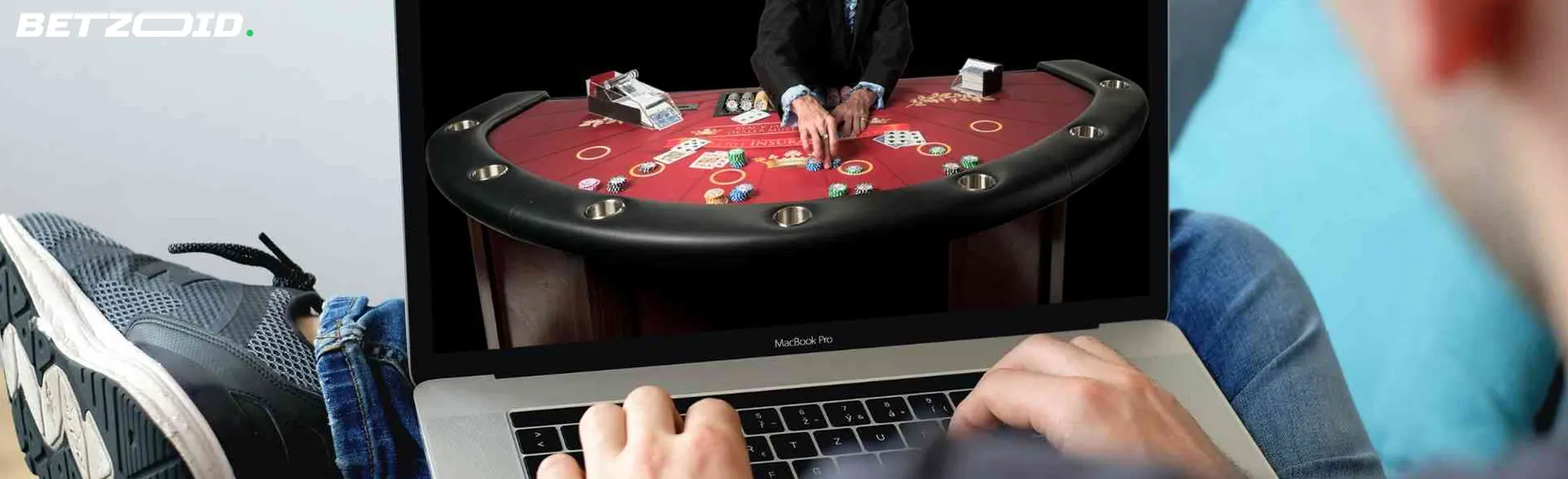A person playing live blackjack on a laptop, showcasing the immersive experience at the best live blackjack sites in Canada.
