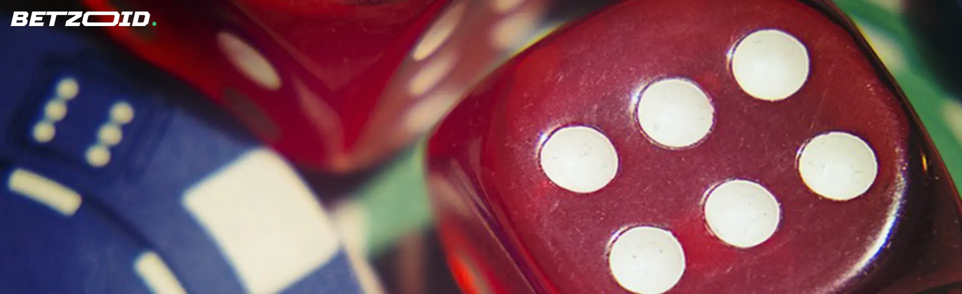 Close-up of red and blue casino dice, symbolizing no deposit casino games.