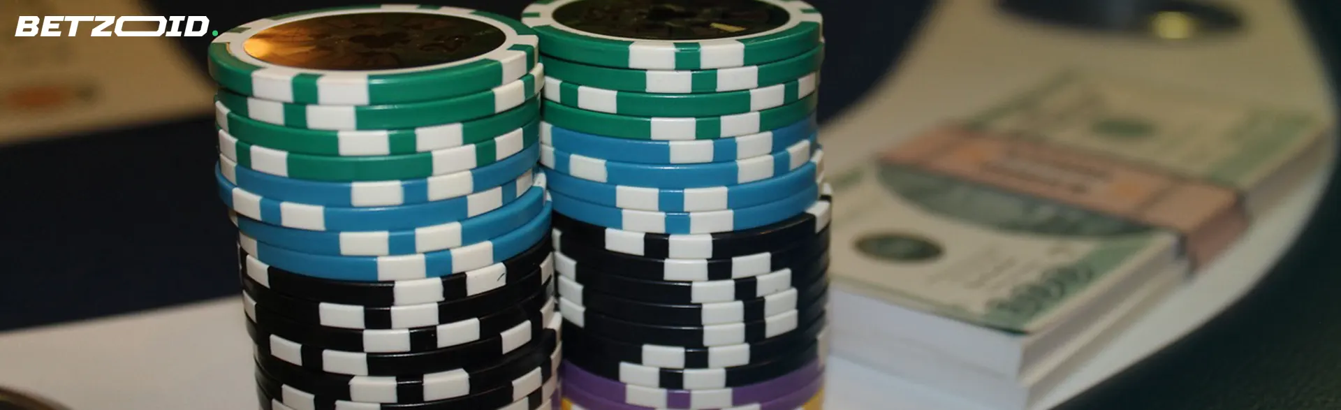 Stacks of colorful casino chips and cash on a table, representing no deposit bonuses in a casino setting.