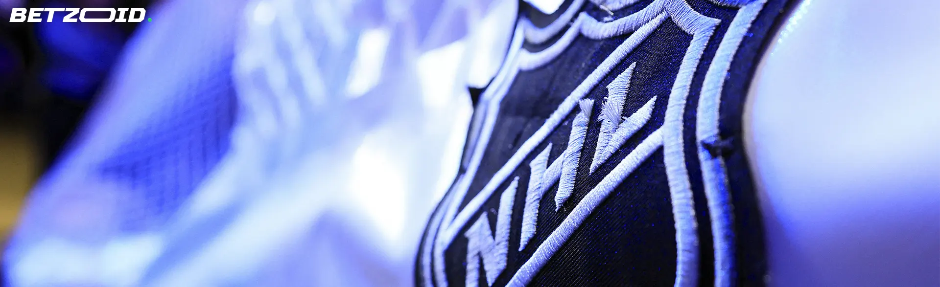 A close-up of an NHL logo on a jersey, representing NHL sports betting sites in Canada.