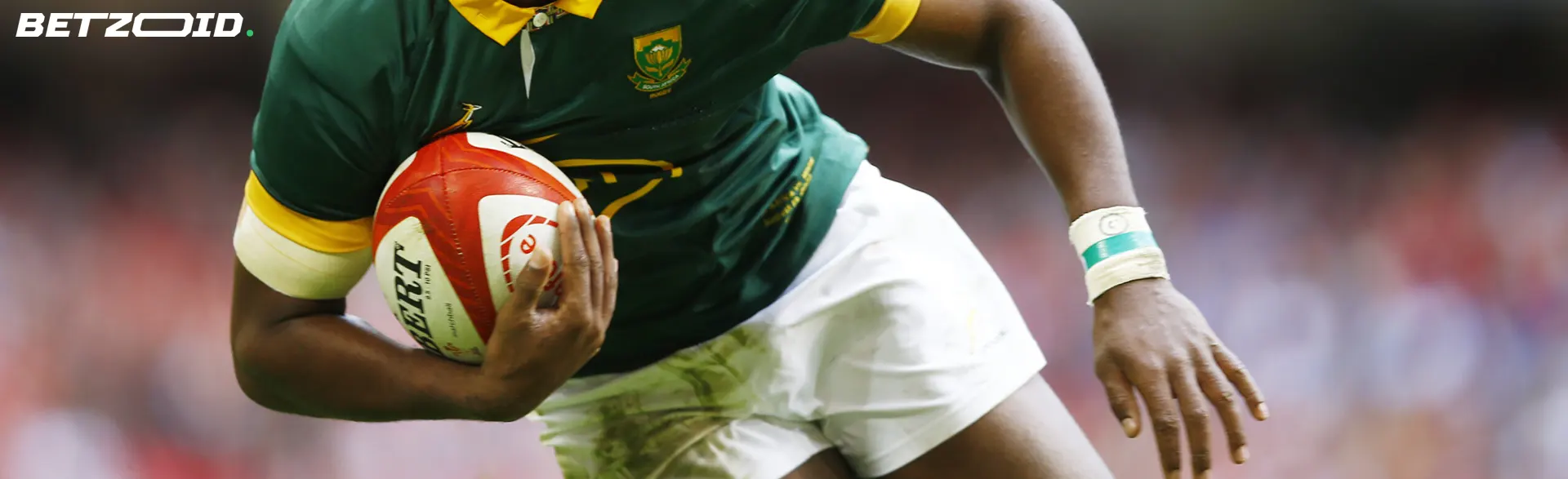 Close-up of a rugby player holding the ball, representing SK betting sites.