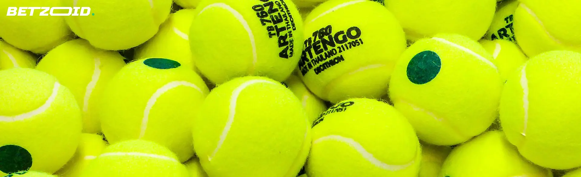A large number of bright yellow tennis balls.