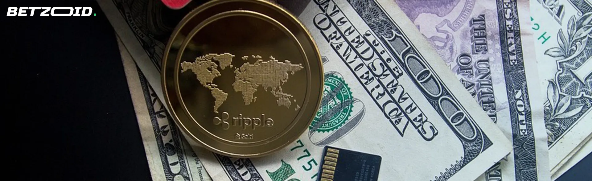 A Ripple coin placed on top of US dollar bills and a microSD card.