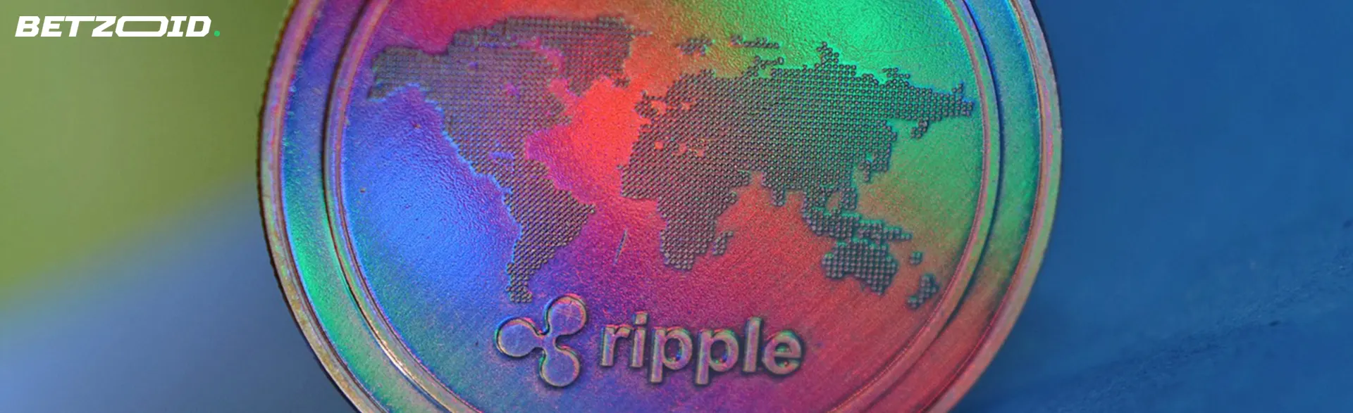 A colorful Ripple coin with a world map design engraved on it.