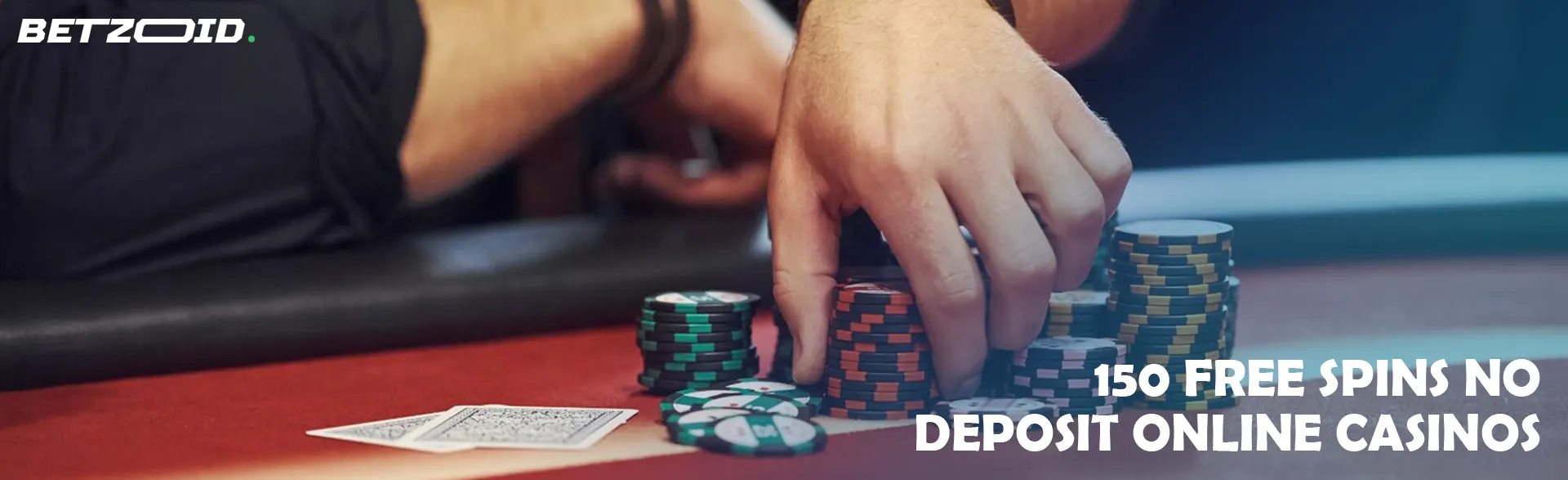 A player holds chips on the casino table.
