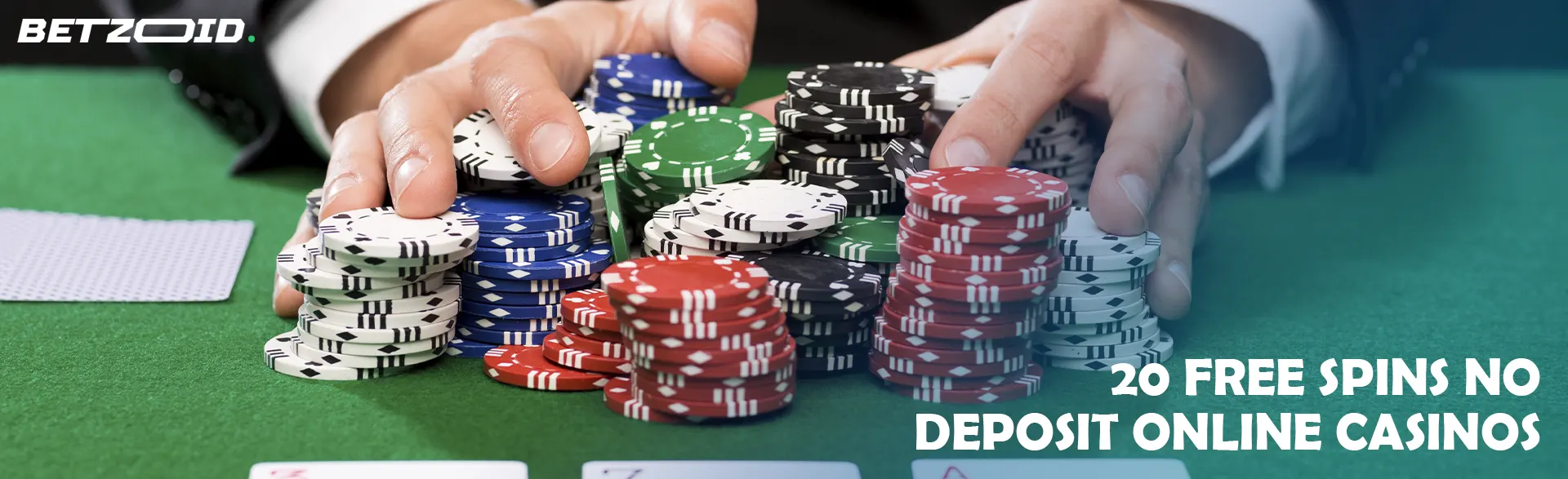A player holds chips on the casino table.