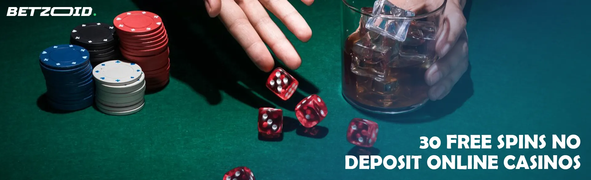 The player throws the dice on the table next to the chips and a glass of drink.