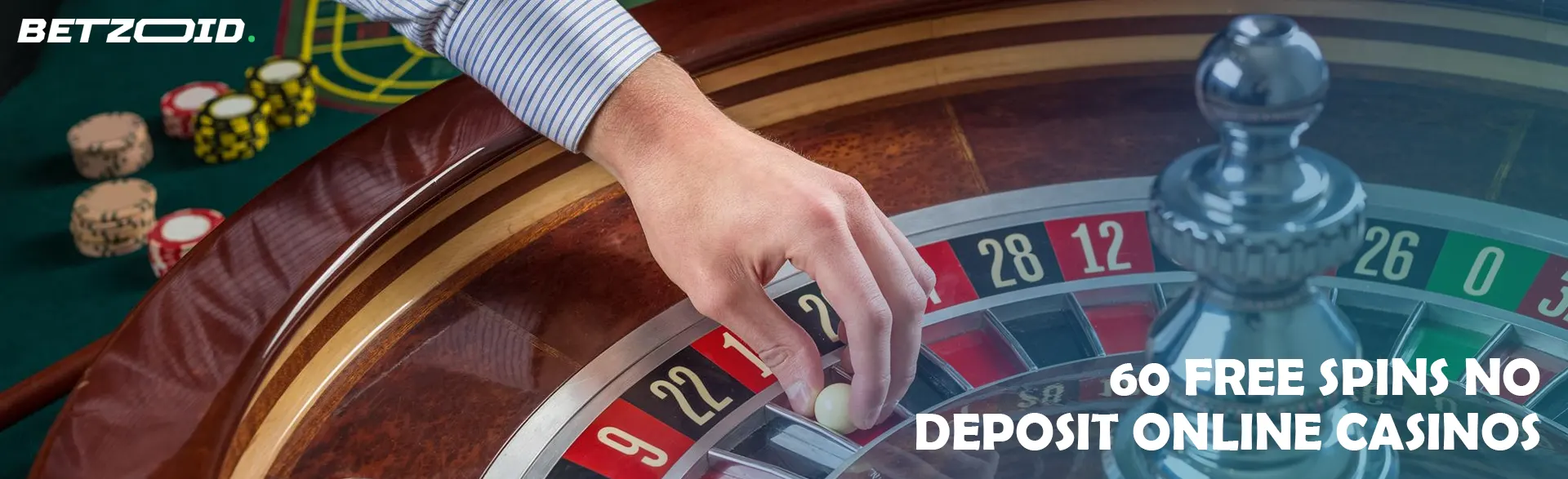 A player places a ball on a casino roulette wheel.