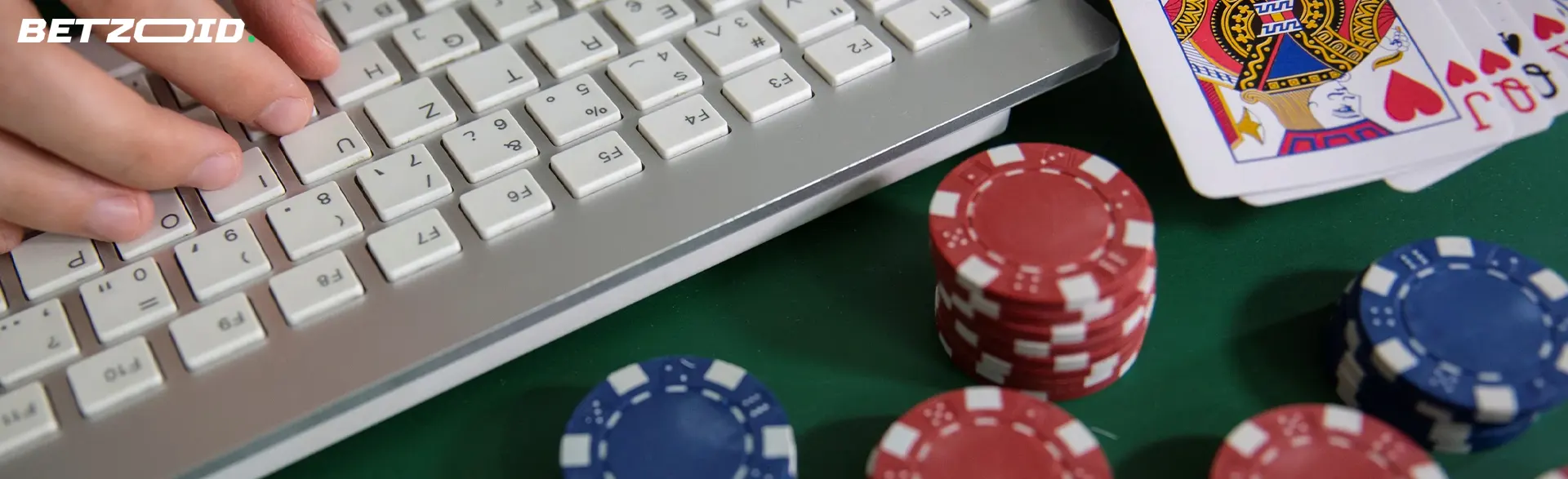 Cards and chips next to the keyboard.
