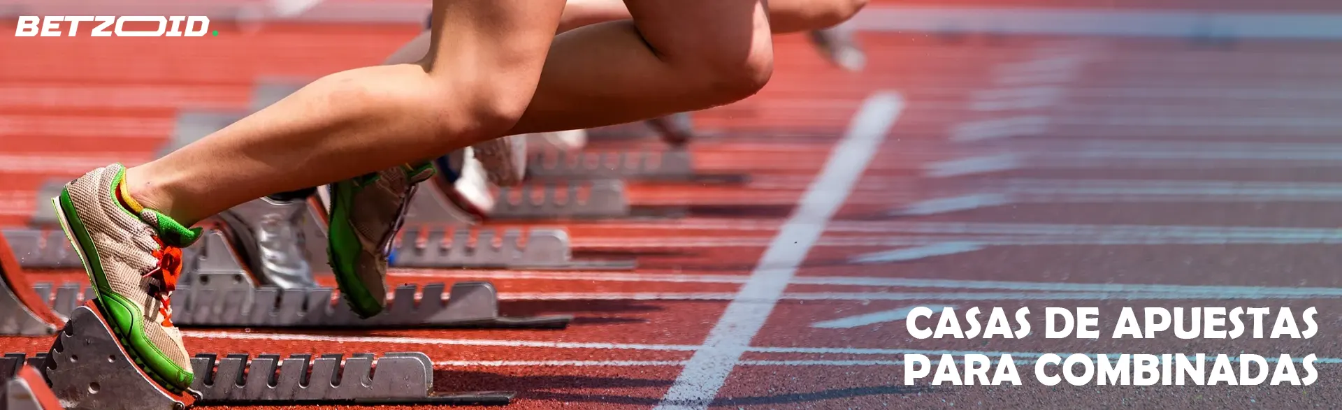 Los atletas parten de bloques en la pista de atletismo.