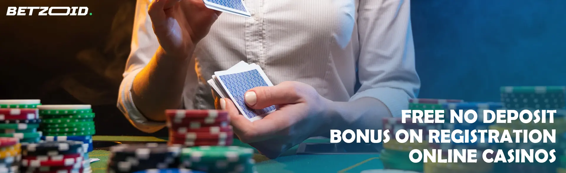 A player shuffles cards over a table with casino chips.