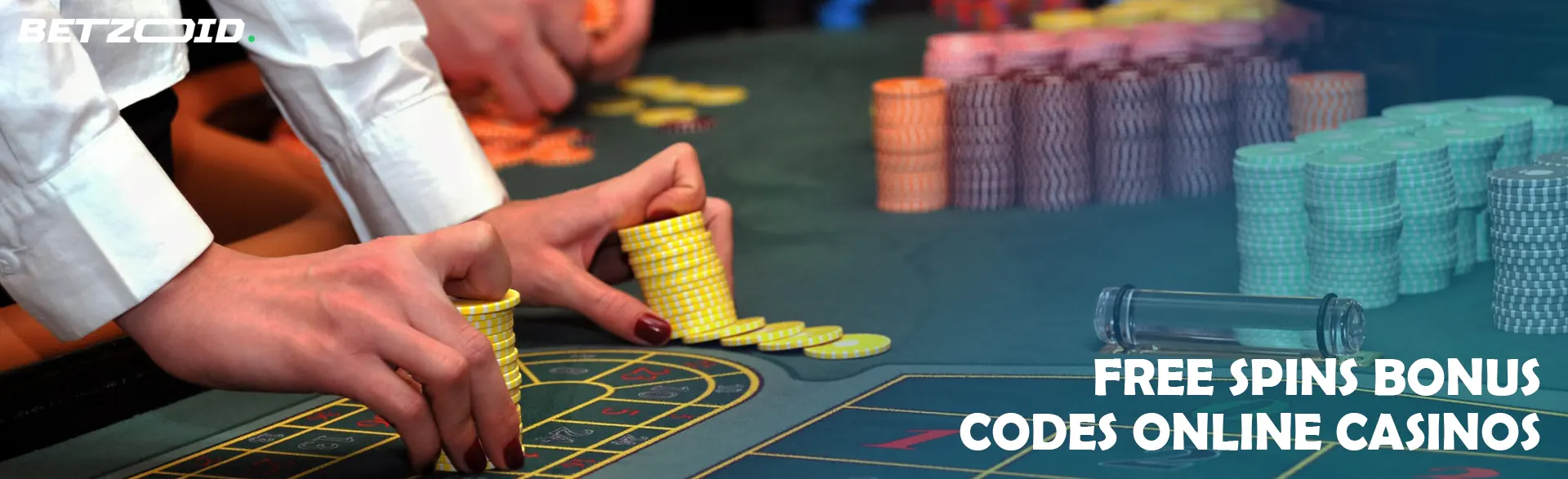 A player holds chips on the casino table.