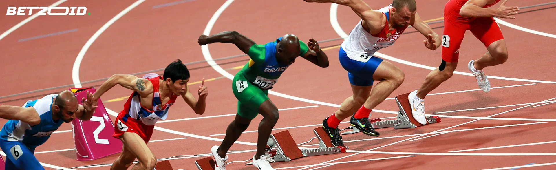 Athletes start a sprint race on the track.