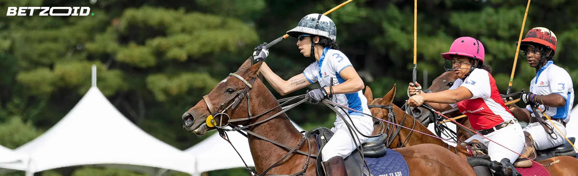 Polo players compete on horseback during the game.
