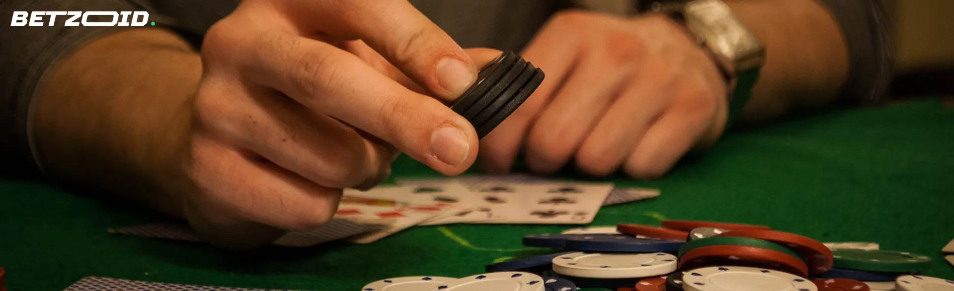 The player places the chips on the table next to the cards.