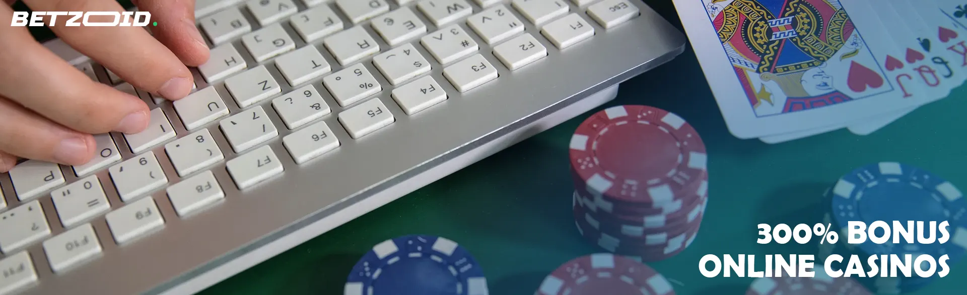Casino cards and chips next to the keyboard.