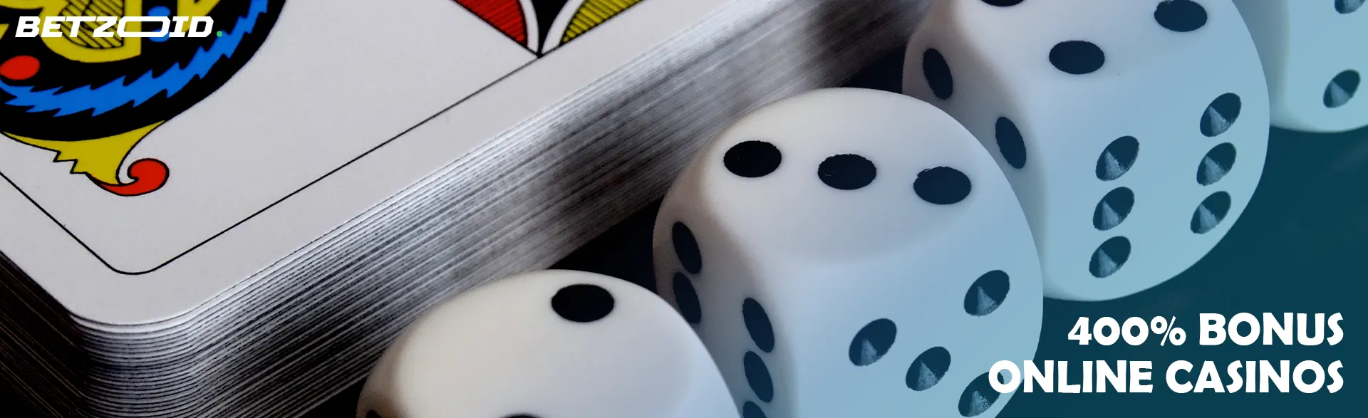 Playing dice next to a deck of cards.