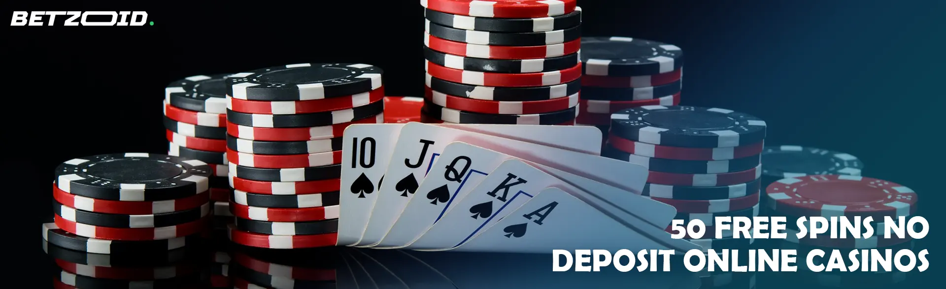 Pile of chips and cards on a dark background.