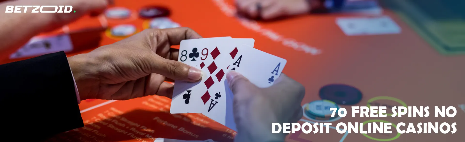 Cards in the hands of the player above the casino table.