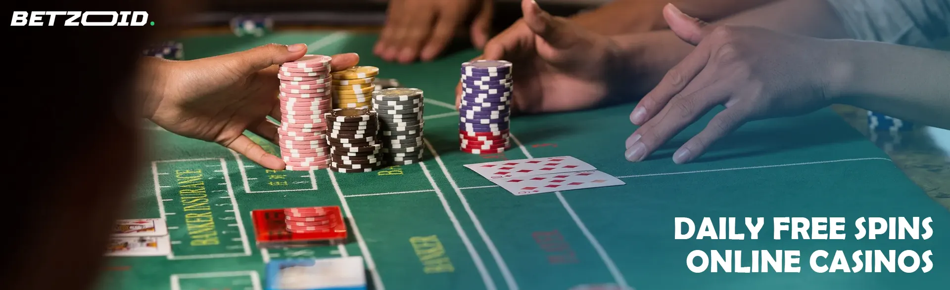 Players place bets with chips on the casino table.