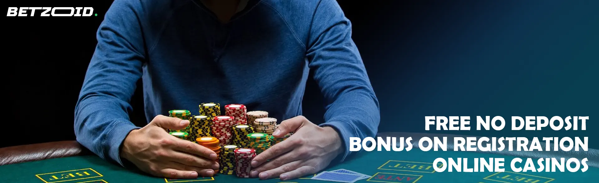 A player is holding a pile of chips on a casino table.