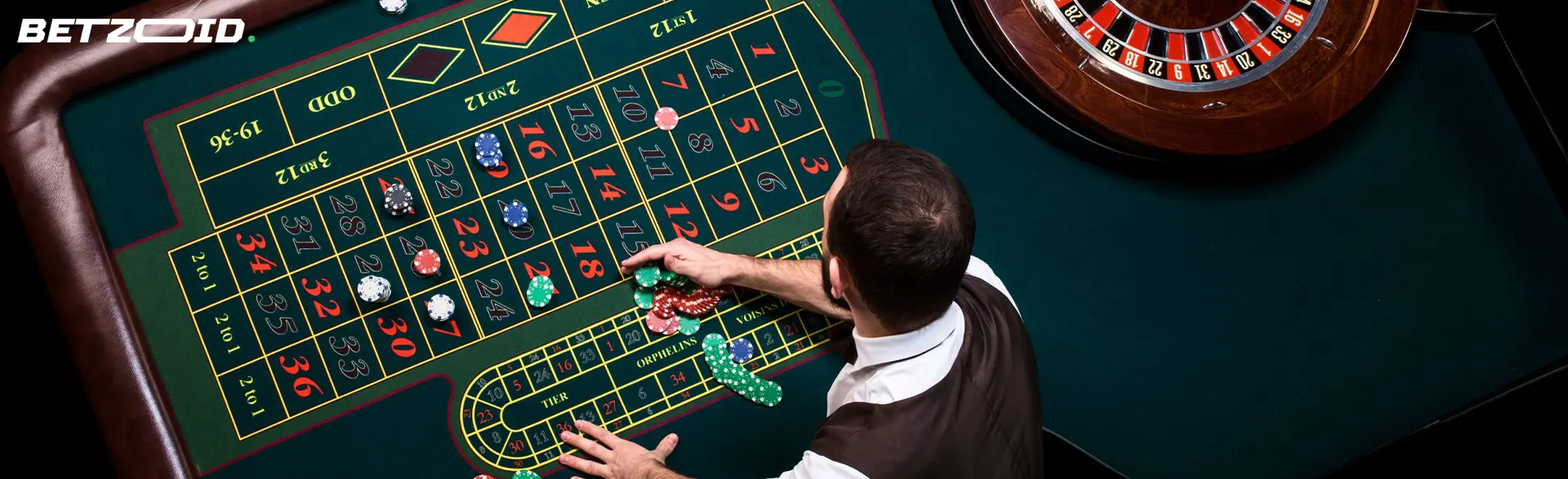 The croupier places the chips on the roulette table.