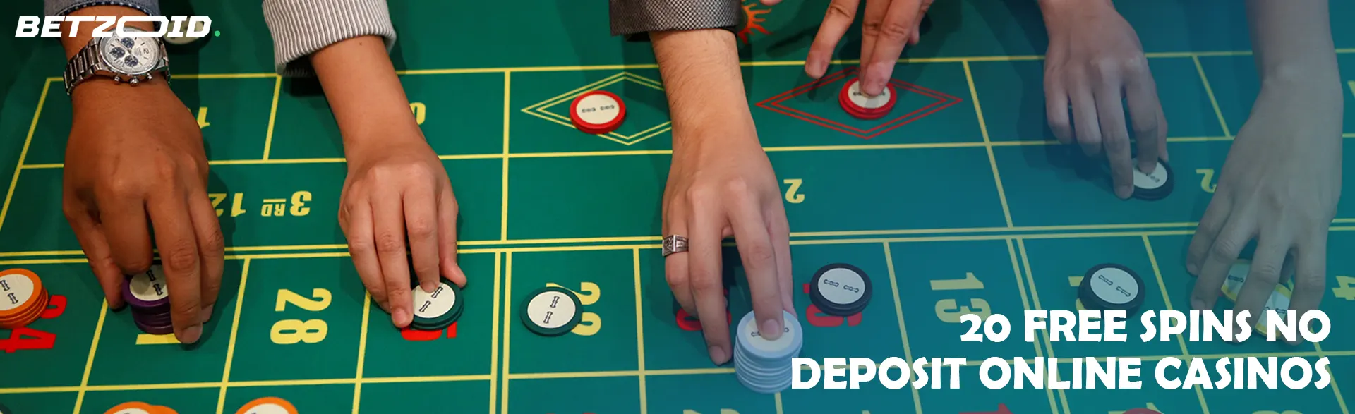 Players place bets with chips on the casino table.