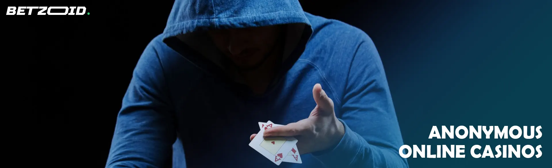 A hooded player holds cards.