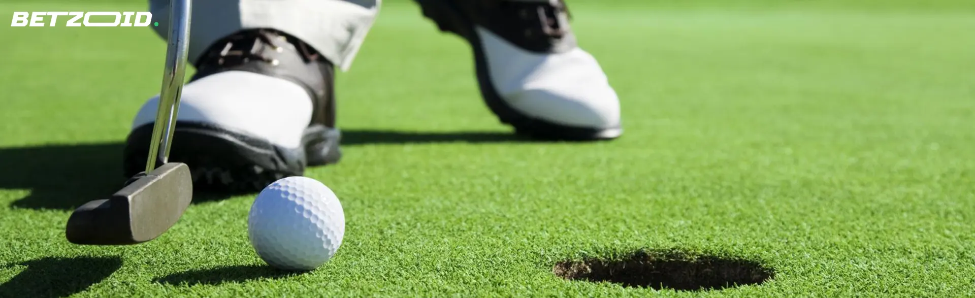 A golfer prepares for a shot.