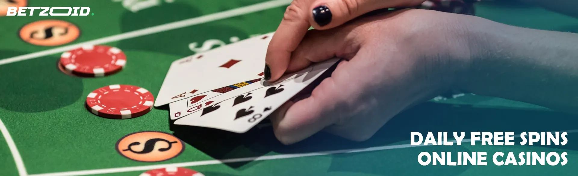 A player holds cards on the casino table.
