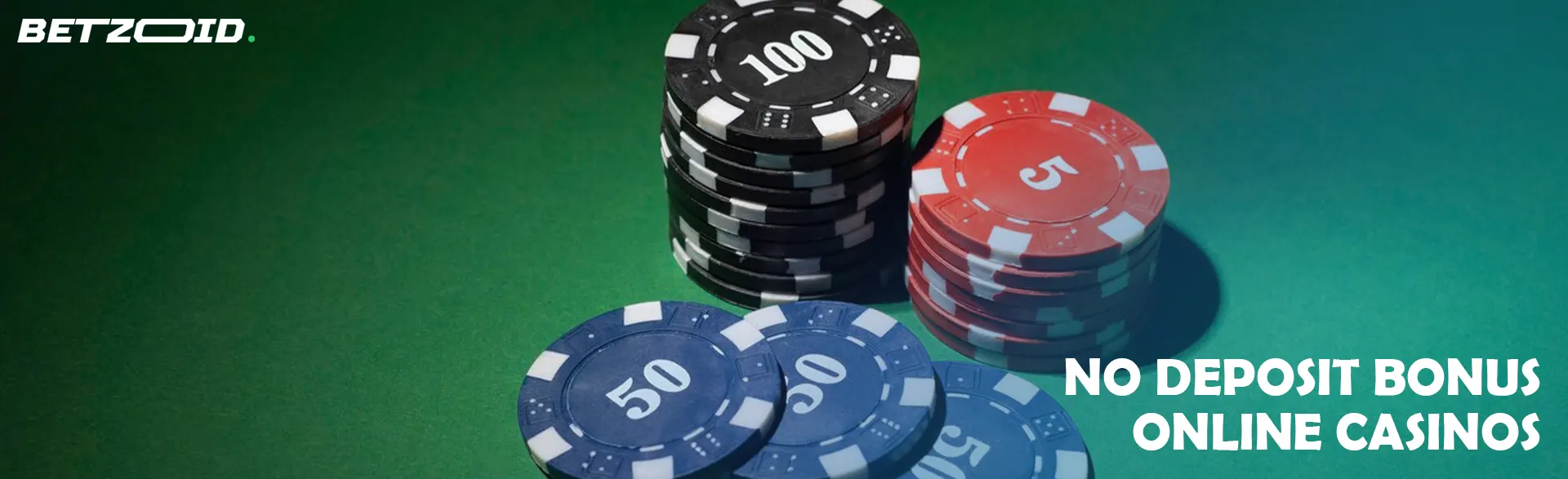 Chips of different denominations on a green table.