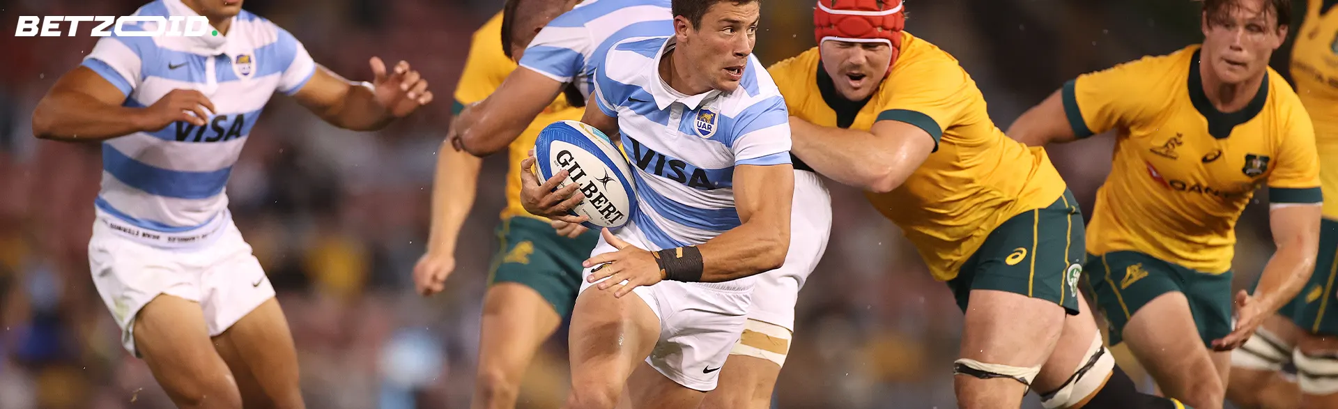 Rugby players fight for the ball during the game.
