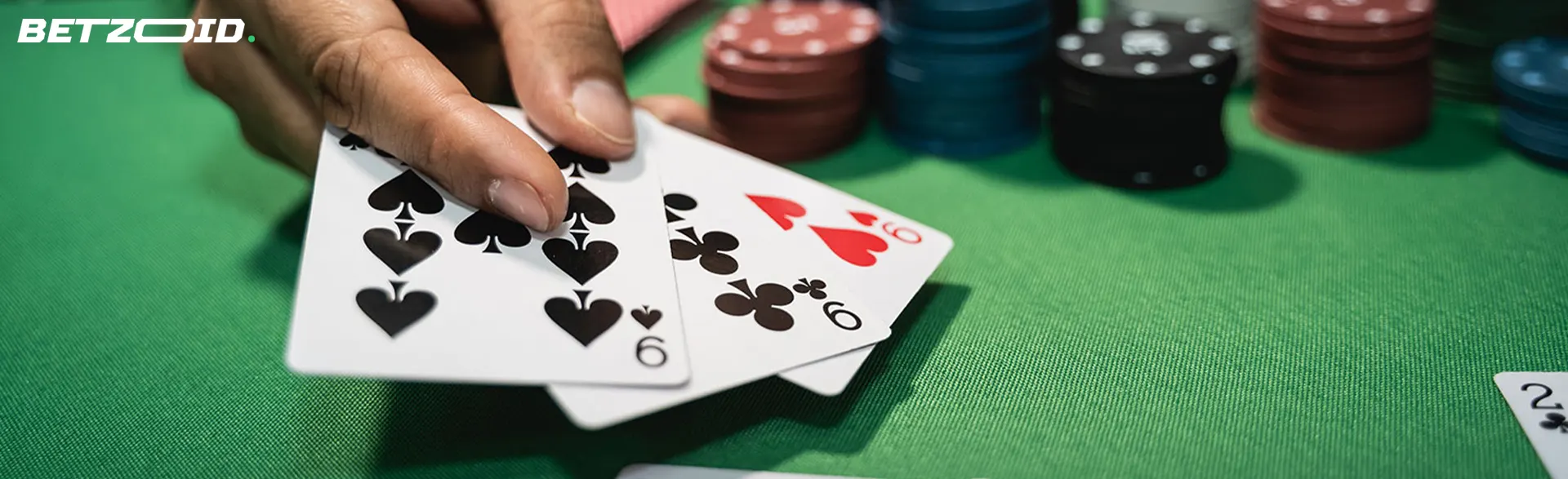 The player shows the cards next to the casino chips.