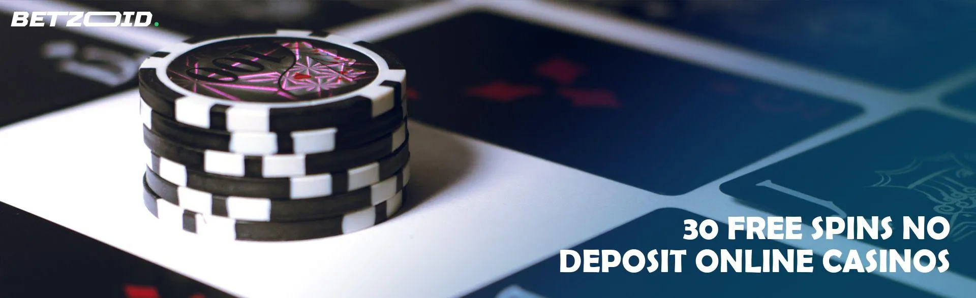 Casino chips next to black cards.