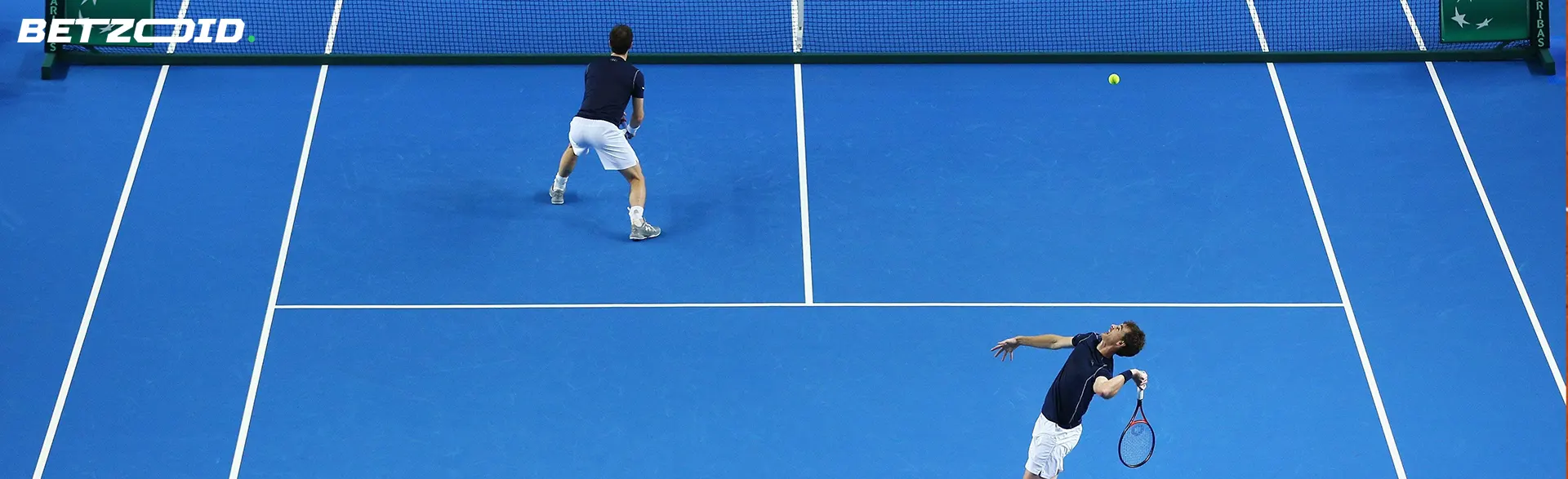 Tennis players on the court in action during the game.