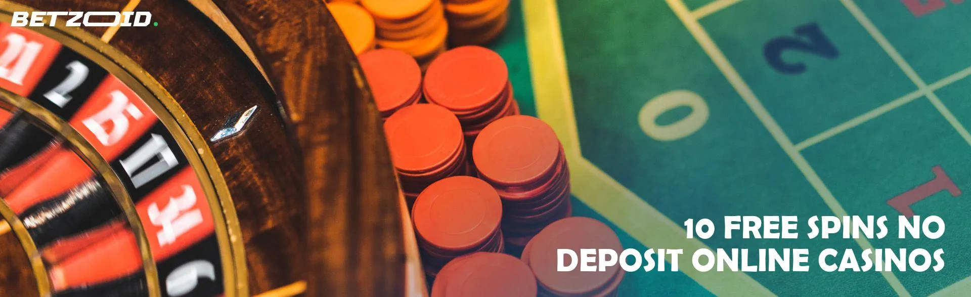 Roulette wheel next to casino chips.