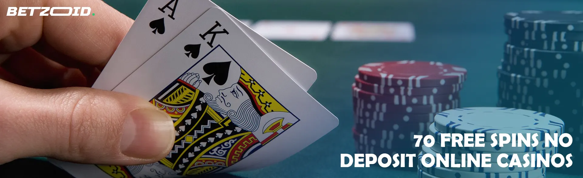 The player holds the cards next to the casino chips.