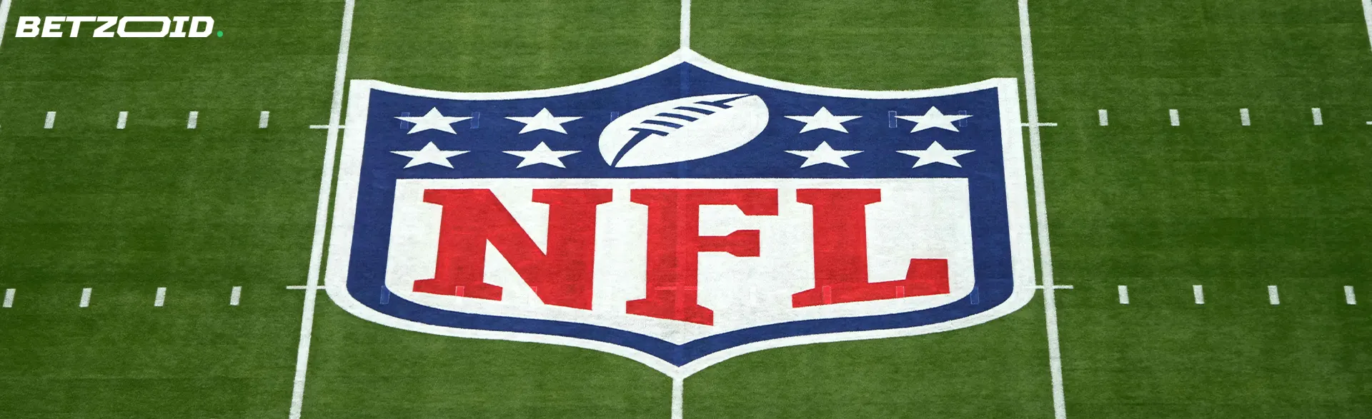 NFL logo on an empty field.