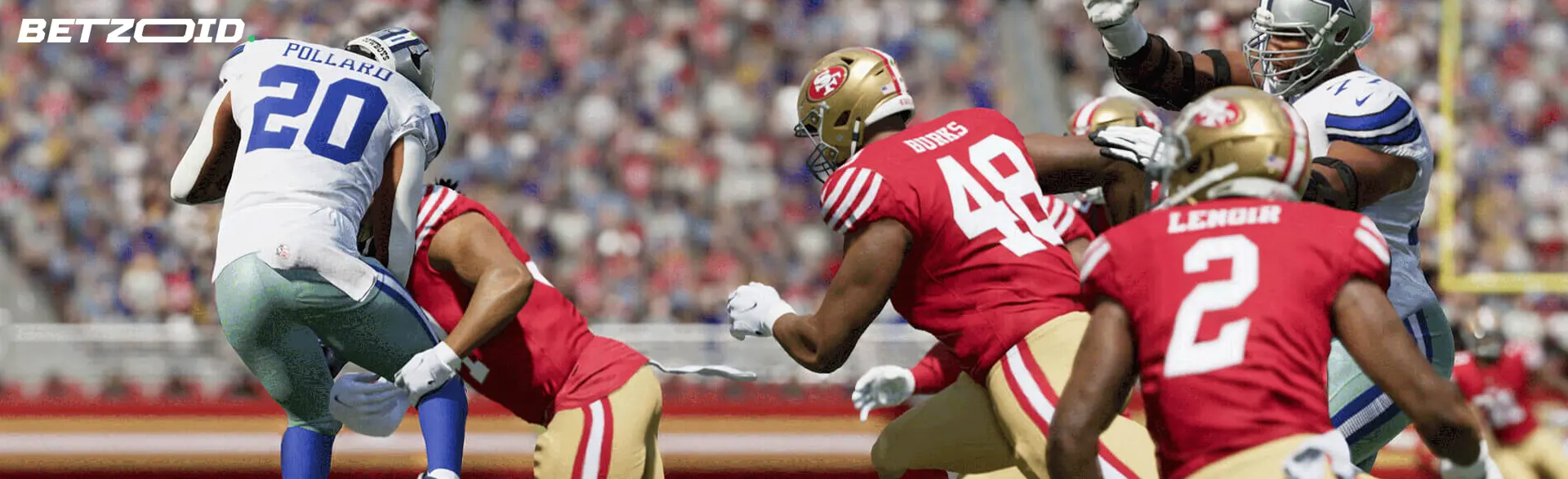 American football players fight for the ball during a game.