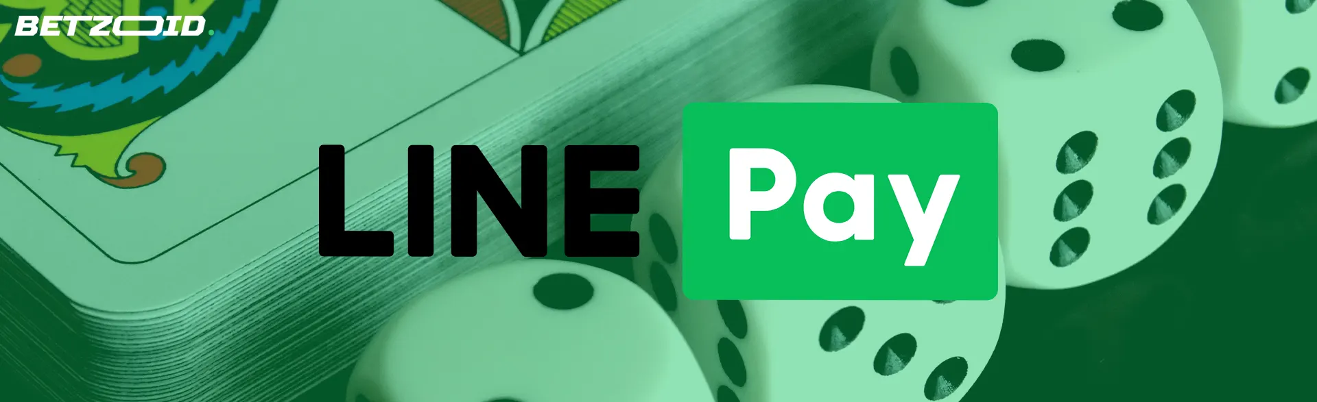 カードとサイコロの背景にある Line PAY 決済システムのロゴ。