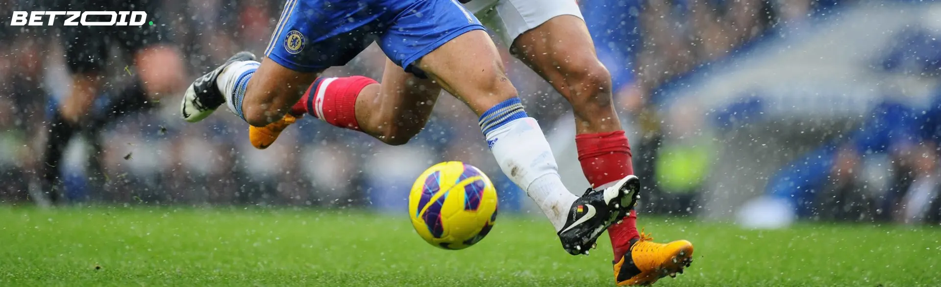 Football players fight for the ball during a game.