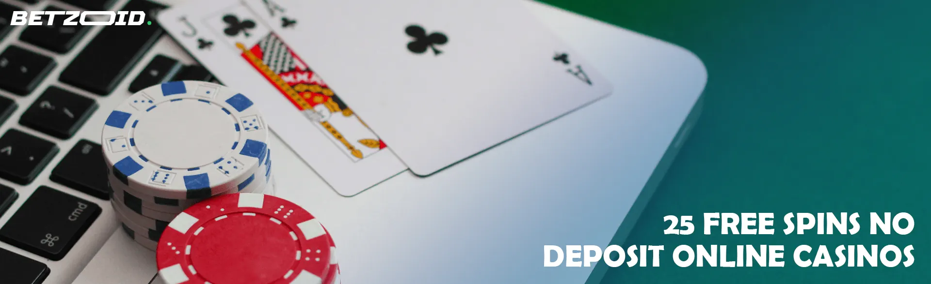 Casino cards and chips on laptop keyboard.