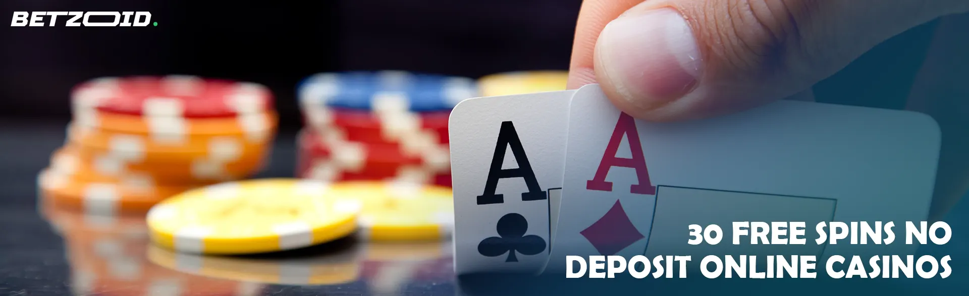 The player holds cards next to casino chips.