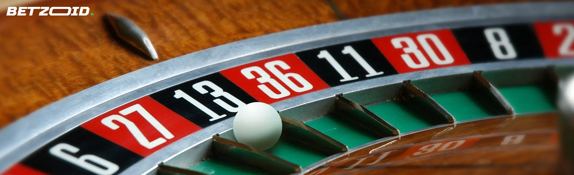 The ball lies on the roulette wheel.