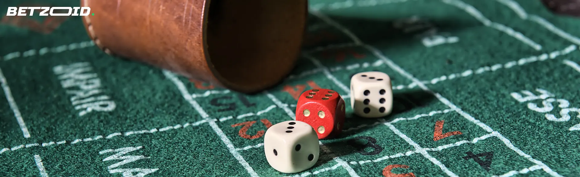 Dice next to the throwing bowl.